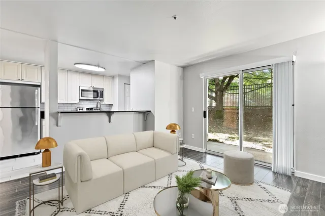 a living room with furniture and a large window