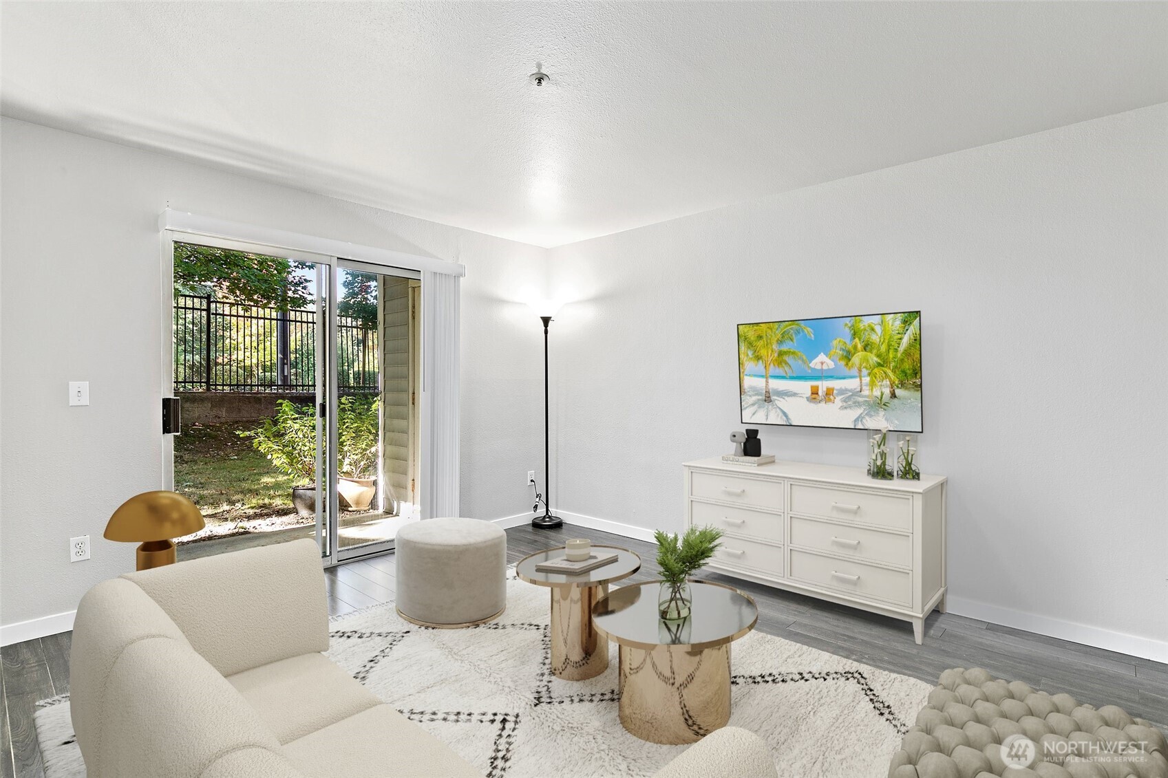 7453 Newcastle Golf Club Road, Unit M103 Newcastle, WA 98059 - Photo 3 of 18 a living room with furniture and a flat screen tv