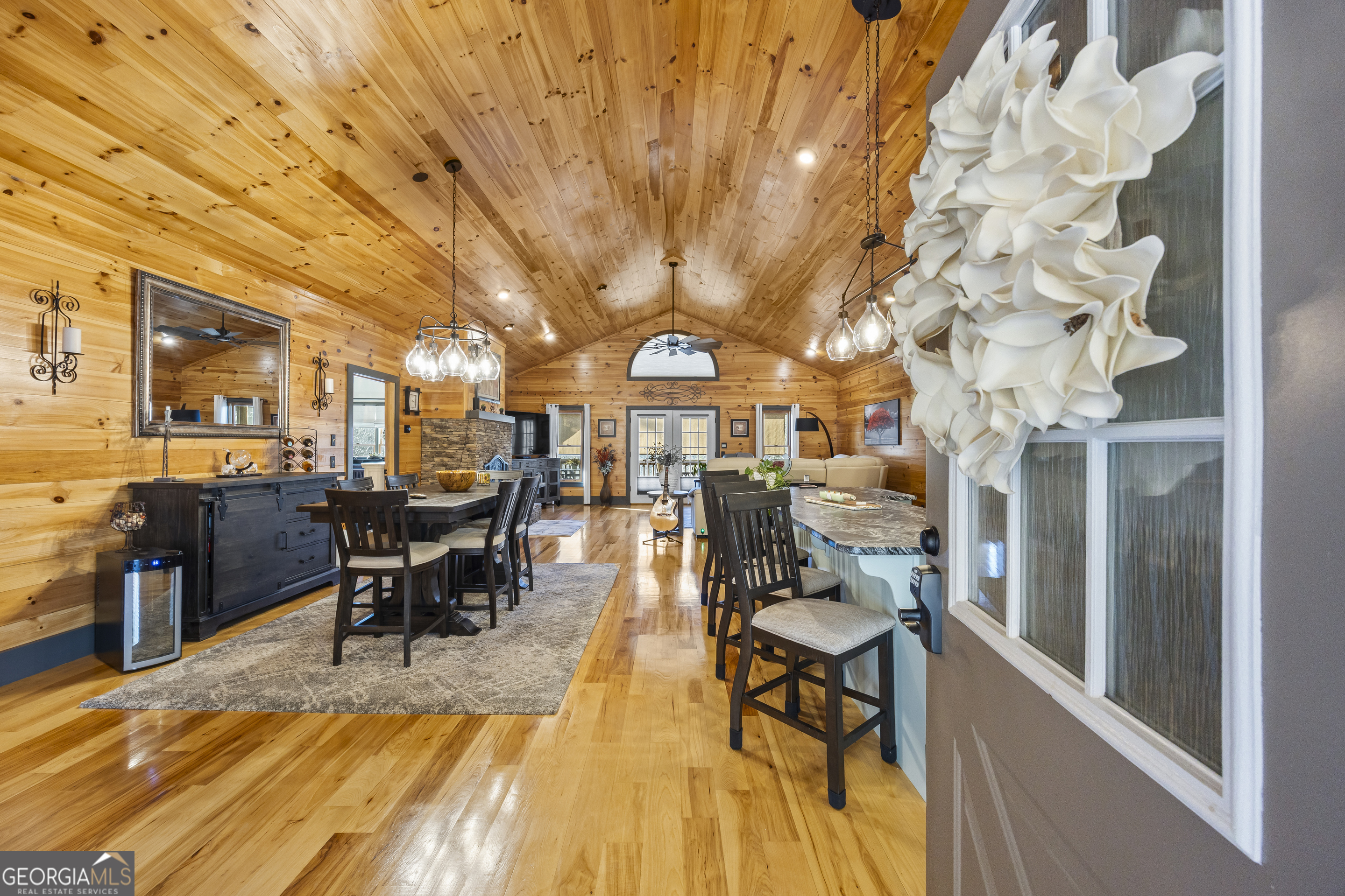 299 Celestial Circle Clayton, GA 30525 - Photo 15 of 89 a view of a patio with table and chairs with wooden floor and fence