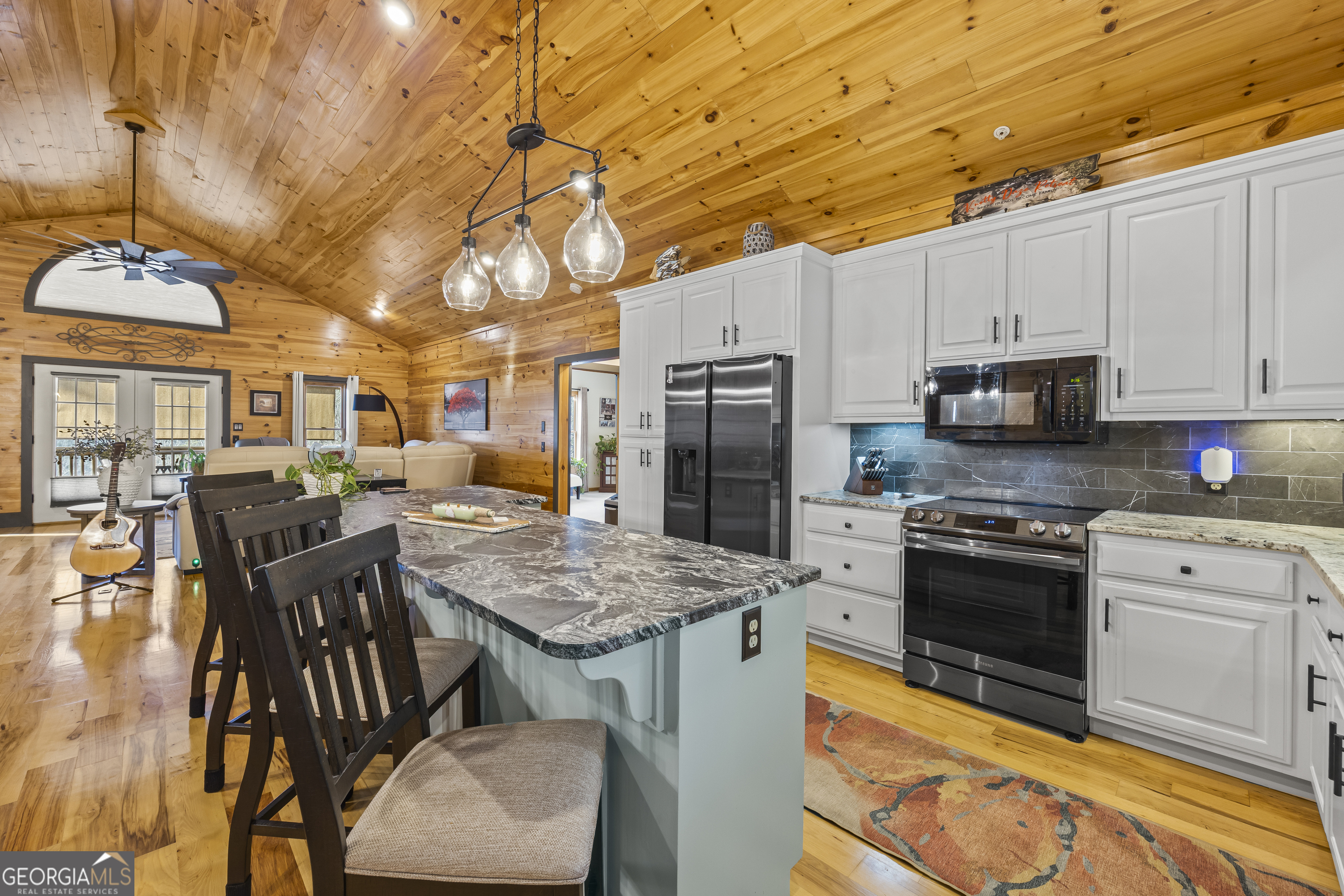 299 Celestial Circle Clayton, GA 30525 - Photo 17 of 89 a kitchen with stainless steel appliances granite countertop a stove refrigerator sink and cabinets