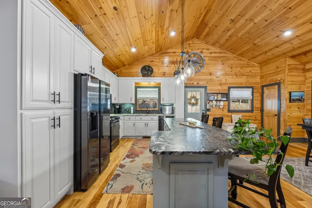 a view of a livingroom with furniture and a workspace