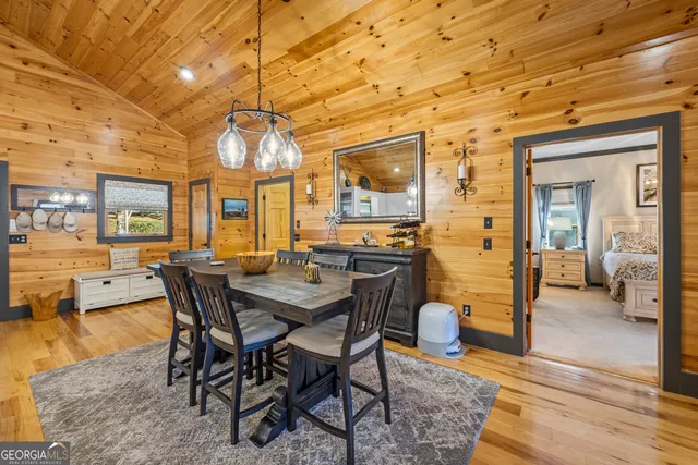 a bathroom with a granite countertop sink mirror vanity and toilet