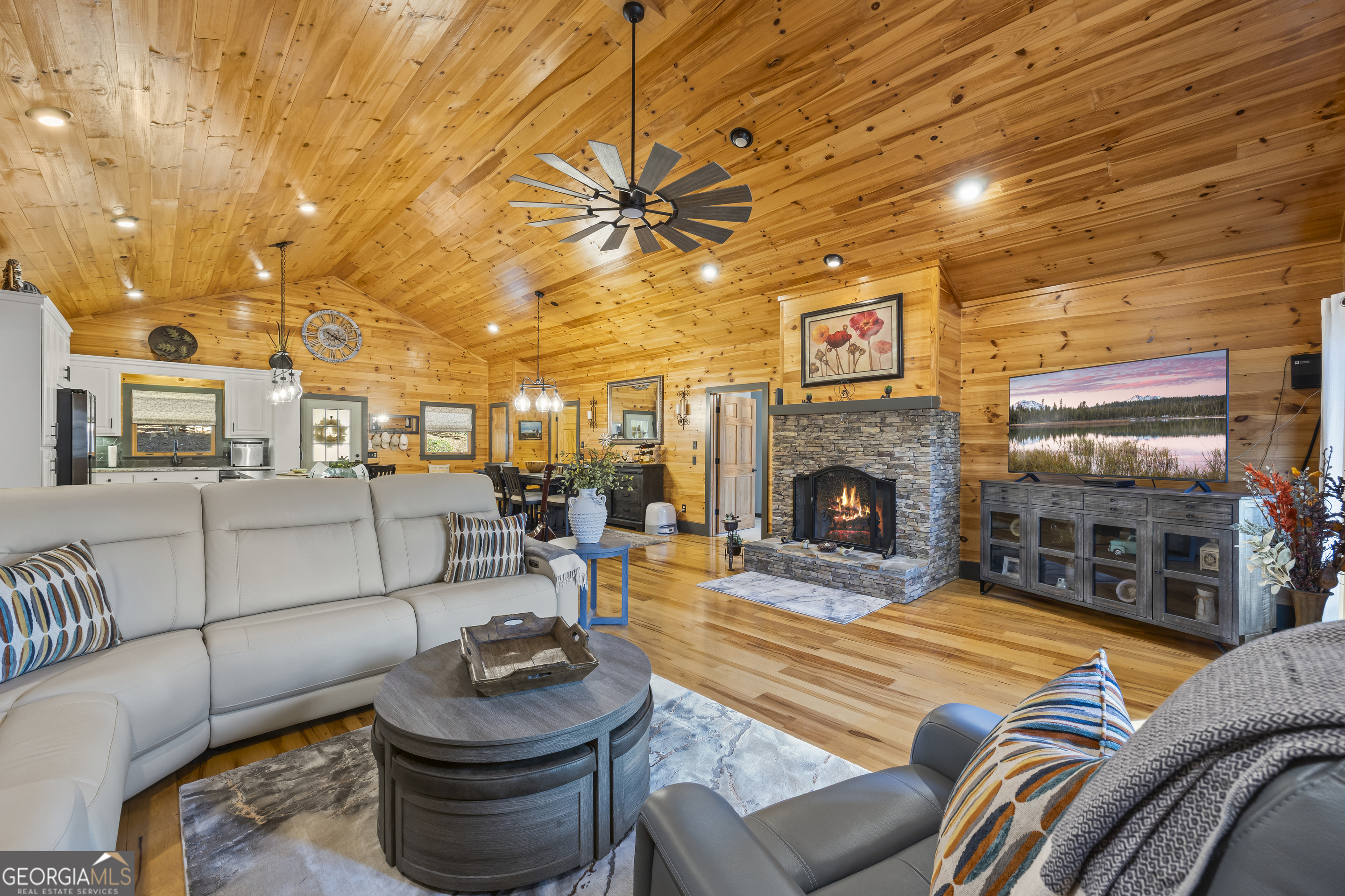 299 Celestial Circle Clayton, GA 30525 - Photo 27 of 89 a living room with furniture and a fireplace