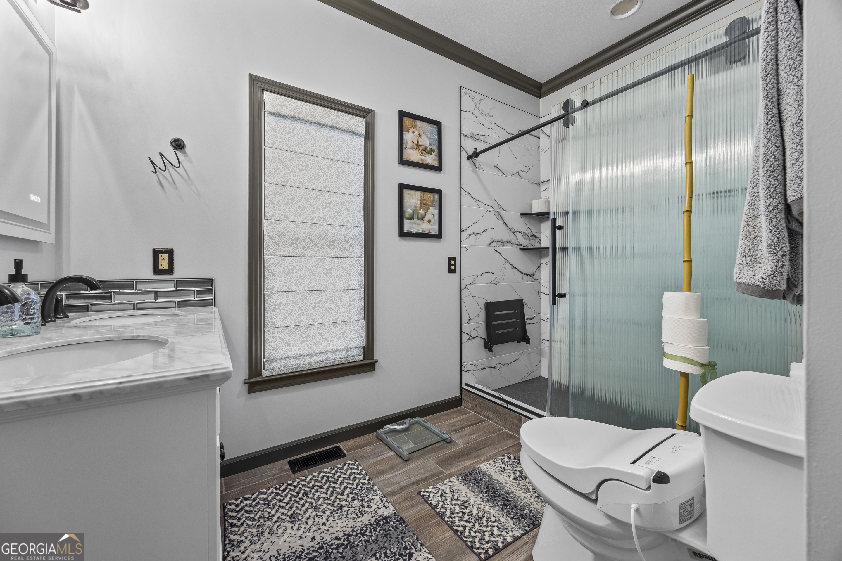 299 Celestial Circle Clayton, GA 30525 - Photo 35 of 89 a bathroom with a granite countertop sink mirror vanity and toilet