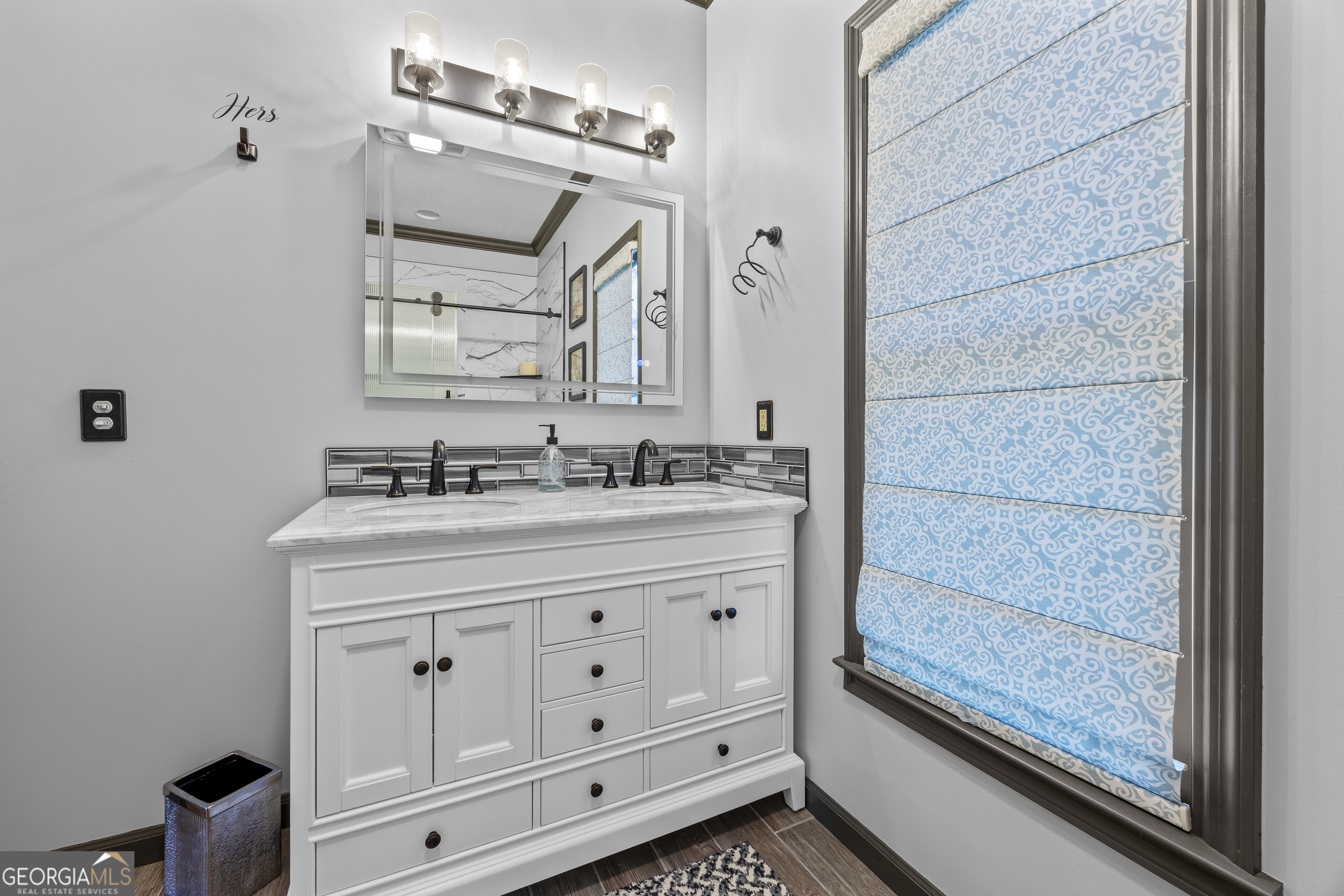 299 Celestial Circle Clayton, GA 30525 - Photo 37 of 89 a bathroom with a sink a vanity and a mirror