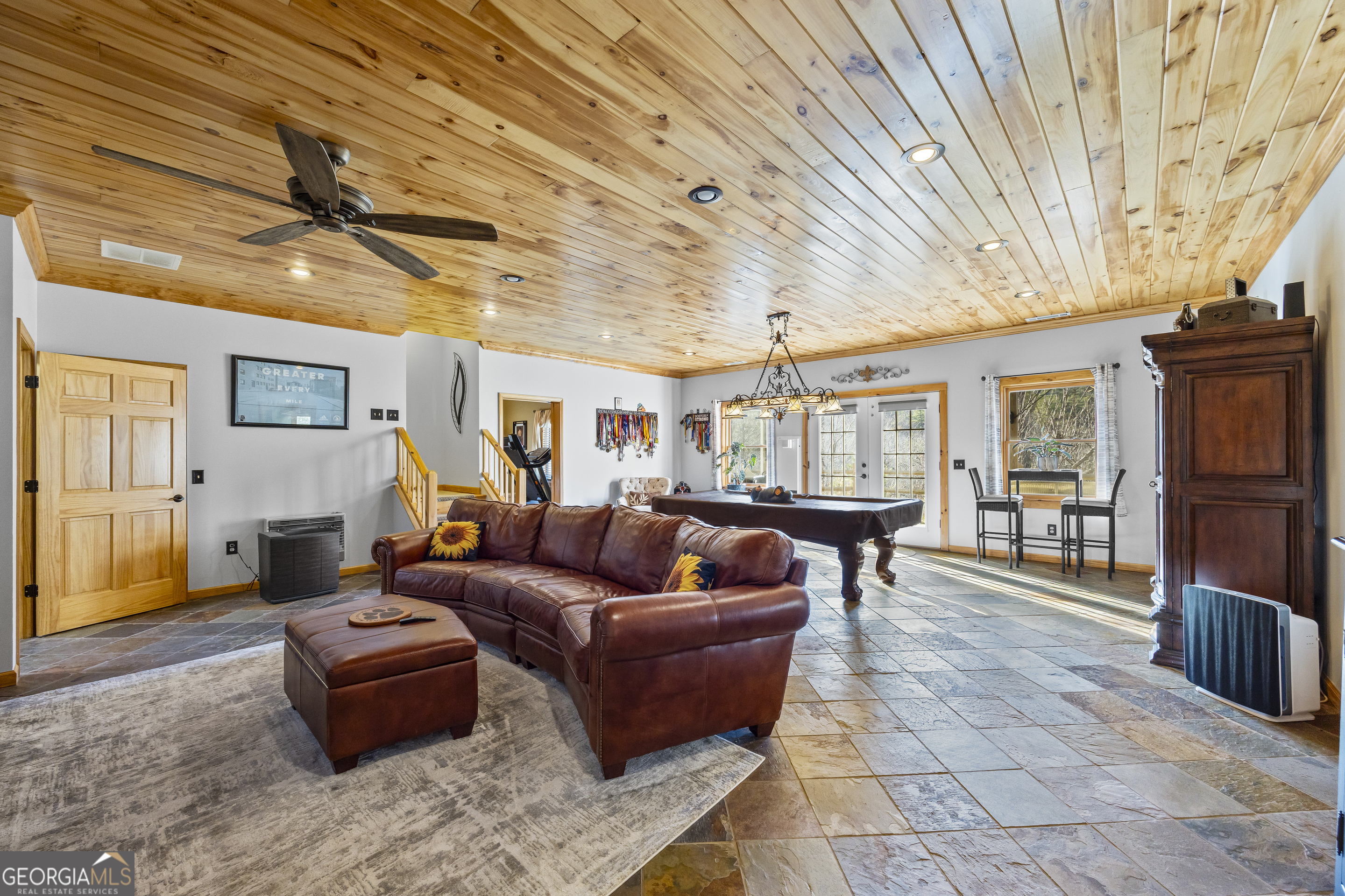 299 Celestial Circle Clayton, GA 30525 - Photo 39 of 89 a living room with furniture a flat screen tv and a table