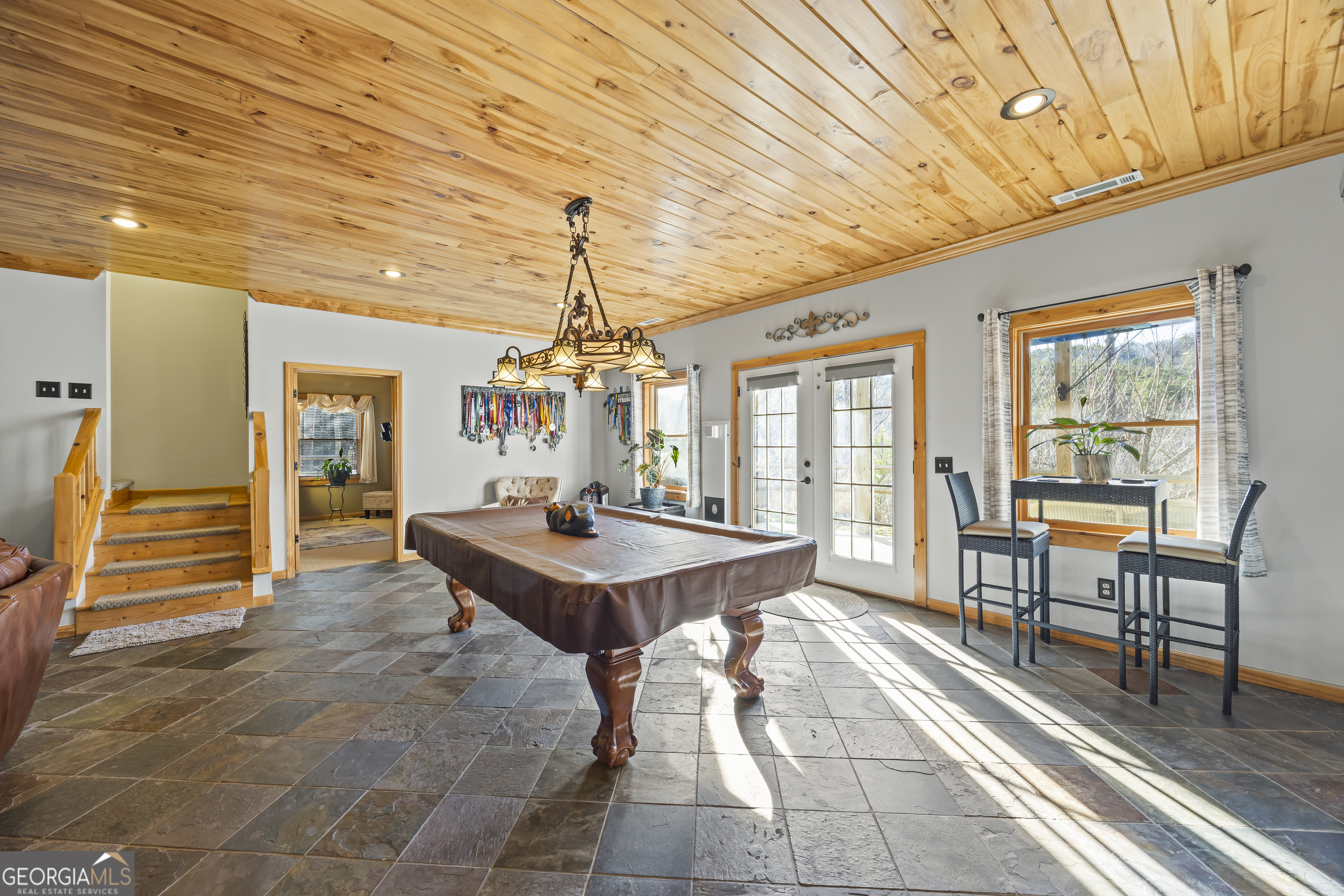 299 Celestial Circle Clayton, GA 30525 - Photo 40 of 89 a dining room with wooden floor and chandelier