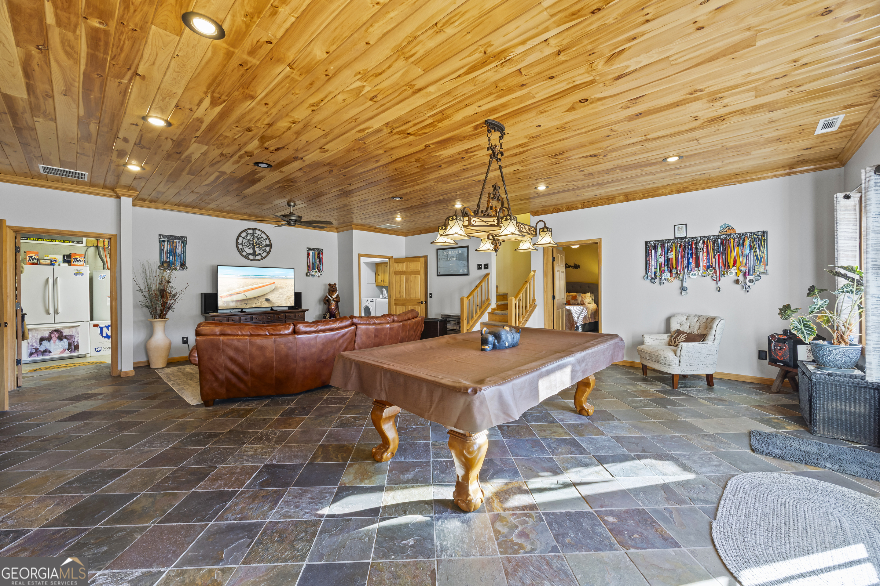 299 Celestial Circle Clayton, GA 30525 - Photo 43 of 89 a living room with lots of furniture and kitchen view