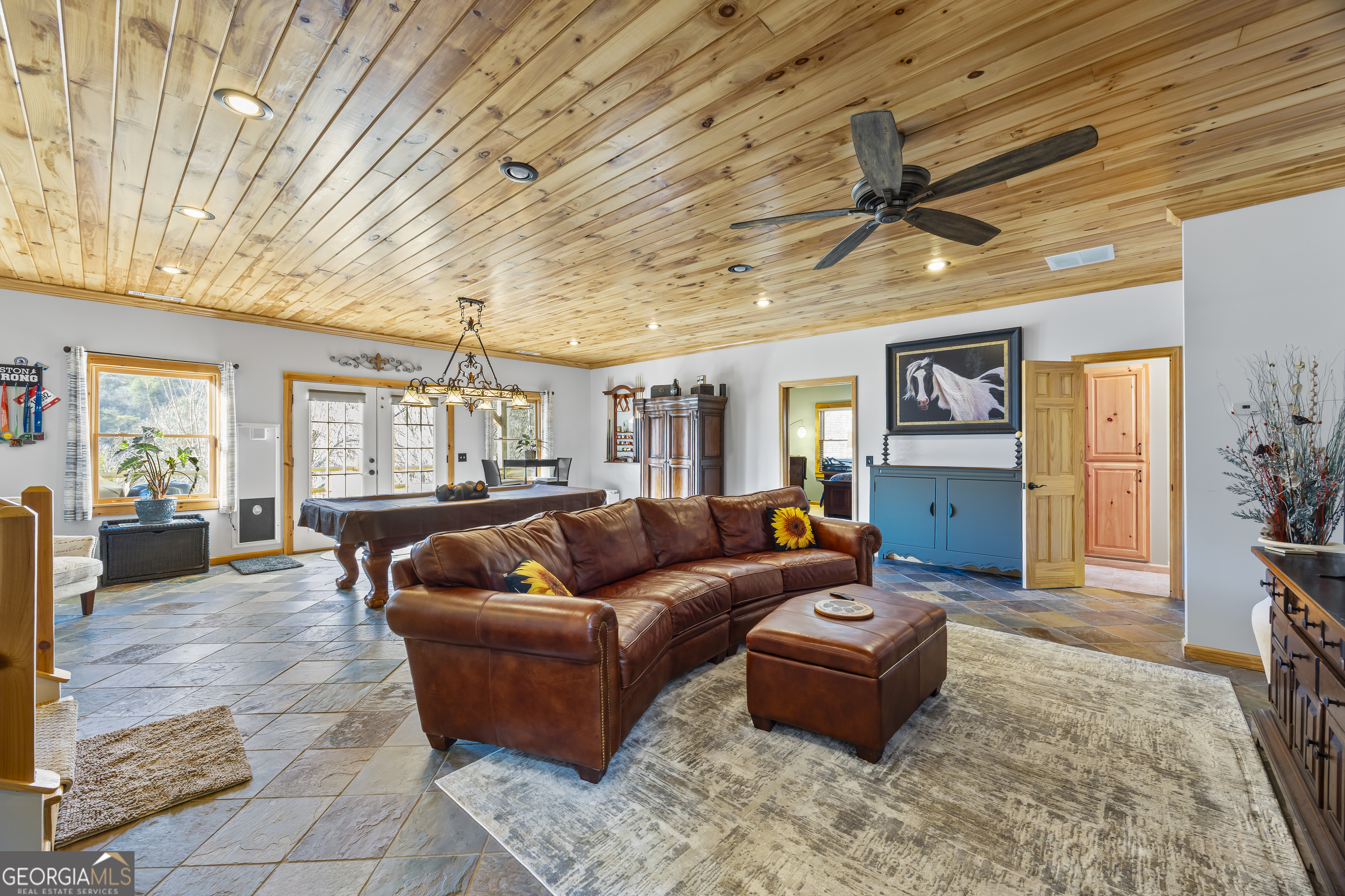 299 Celestial Circle Clayton, GA 30525 - Photo 44 of 89 a living room with furniture and a wooden floor