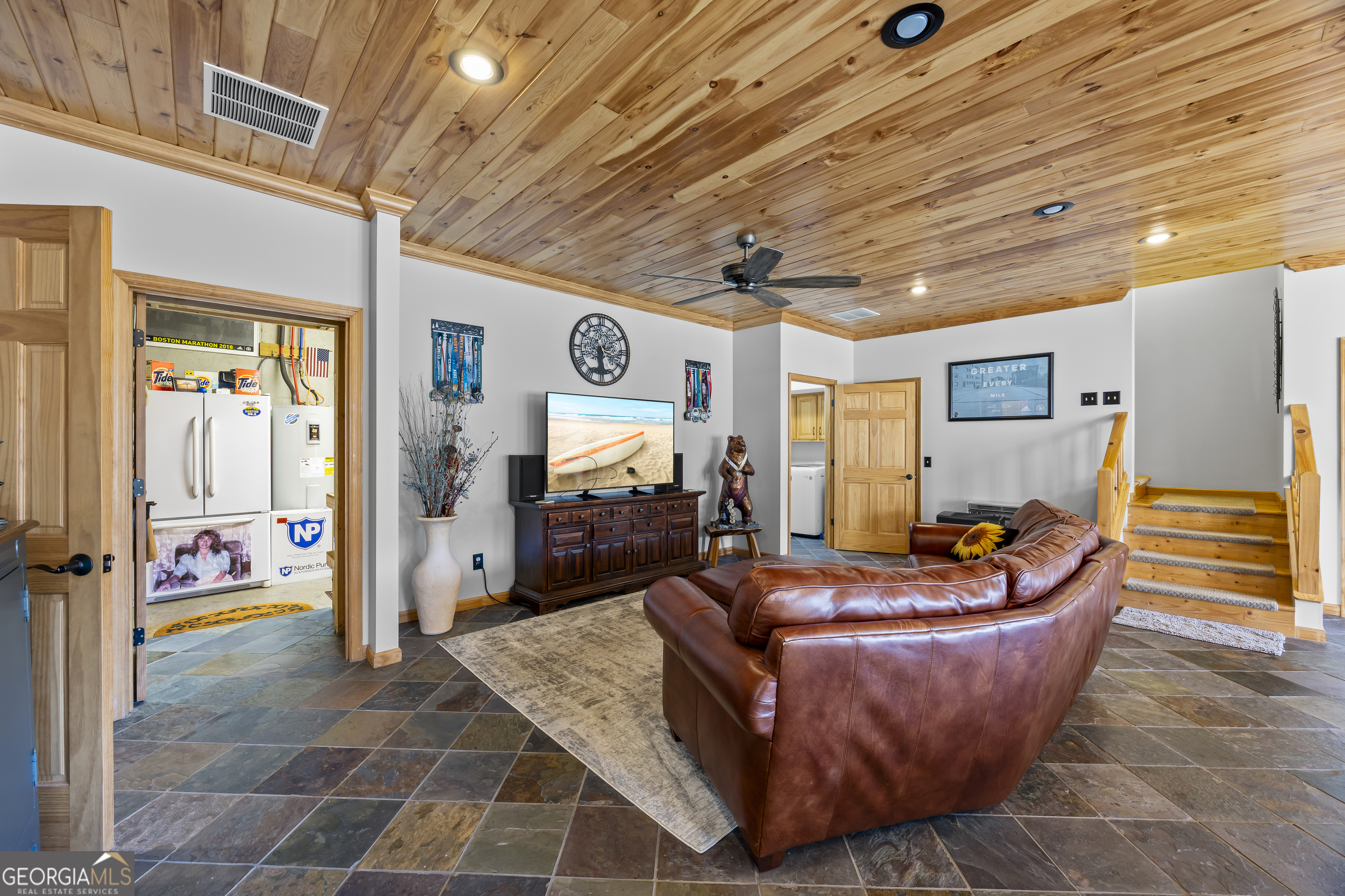 299 Celestial Circle Clayton, GA 30525 - Photo 46 of 89 a living room with furniture and a flat screen tv