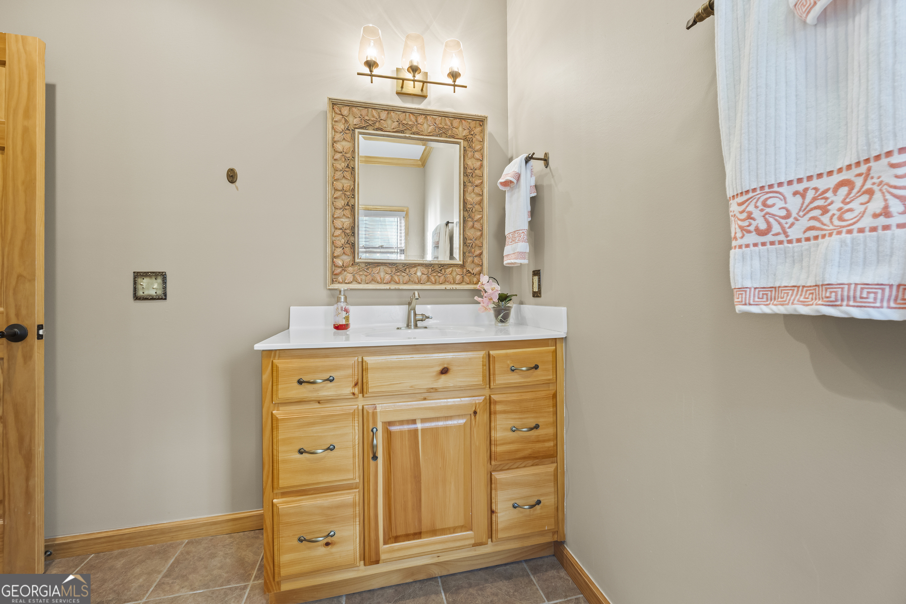 299 Celestial Circle Clayton, GA 30525 - Photo 58 of 89 a bathroom with a sink and a mirror