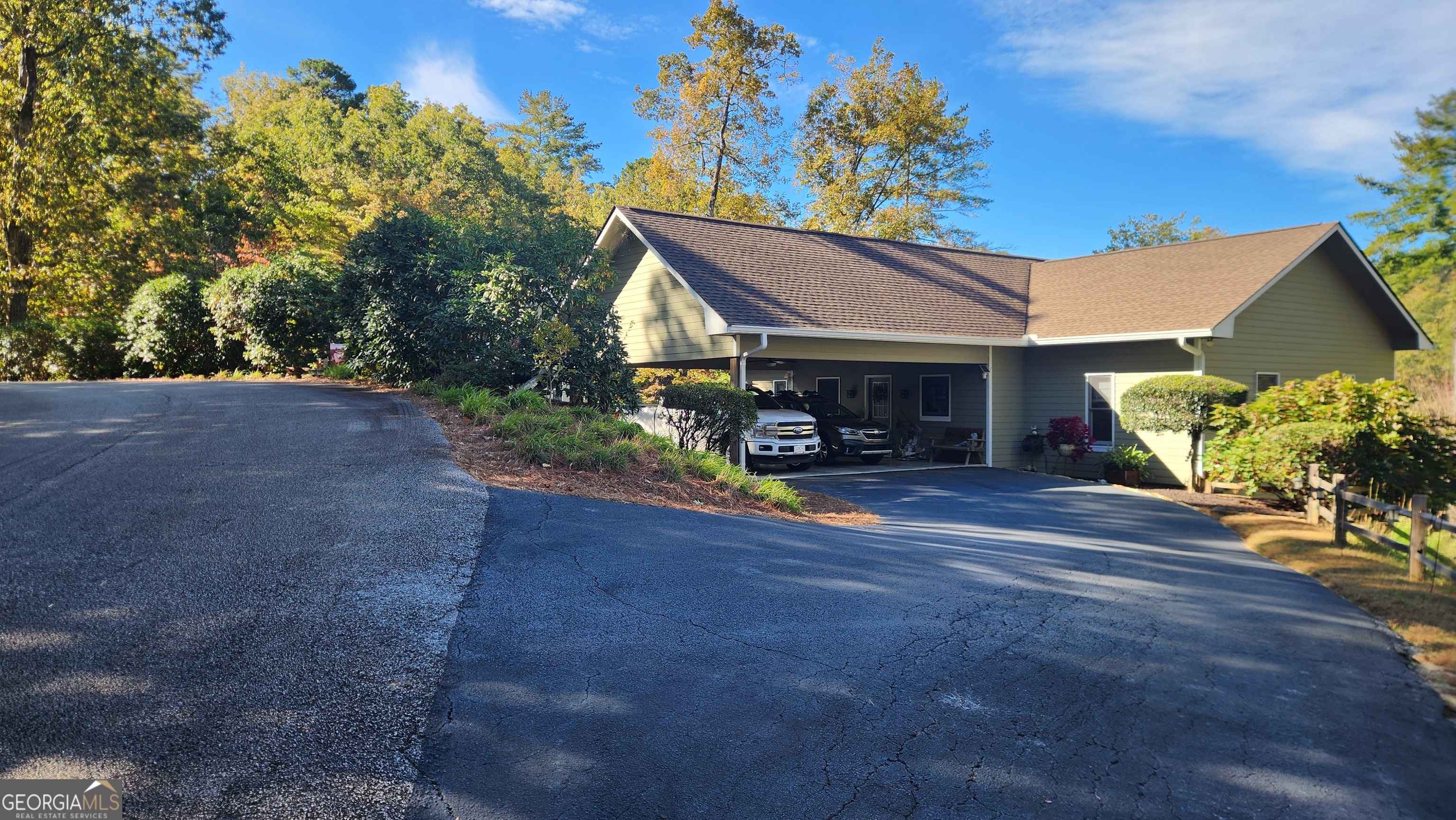 299 Celestial Circle Clayton, GA 30525 - Photo 9 of 89 a view of a house with a garage and a fire pit