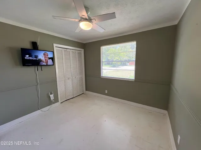 a view of livingroom with furniture window and a projector