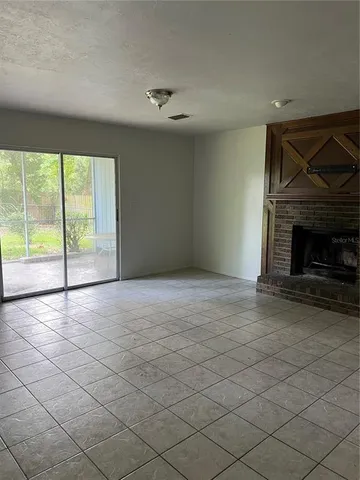 an empty room with fireplace