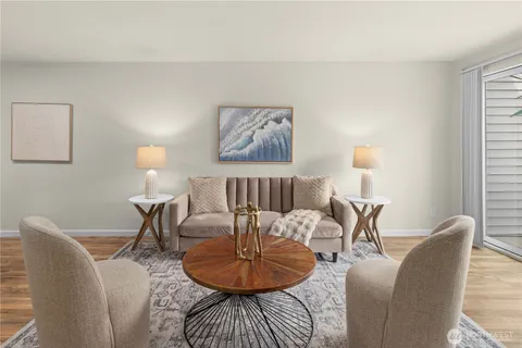 a living room with furniture and a lamp
