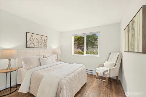 a bedroom with a bed and a chair
