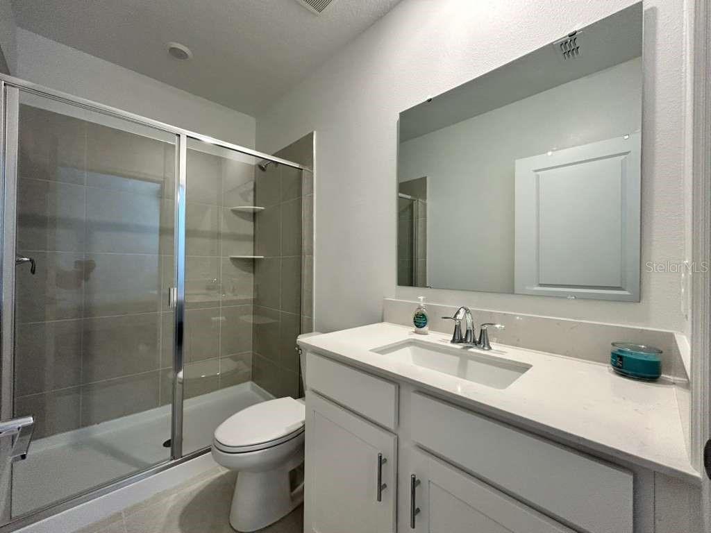 3258 Armstrong Avenue Clermont, FL 34714 - Photo 15 of 18 a bathroom with a sink toilet and shower