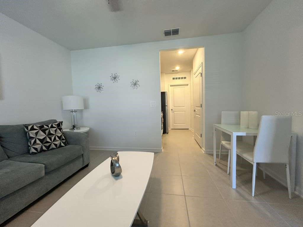 3258 Armstrong Avenue Clermont, FL 34714 - Photo 7 of 18 a living room with furniture and a wooden floor