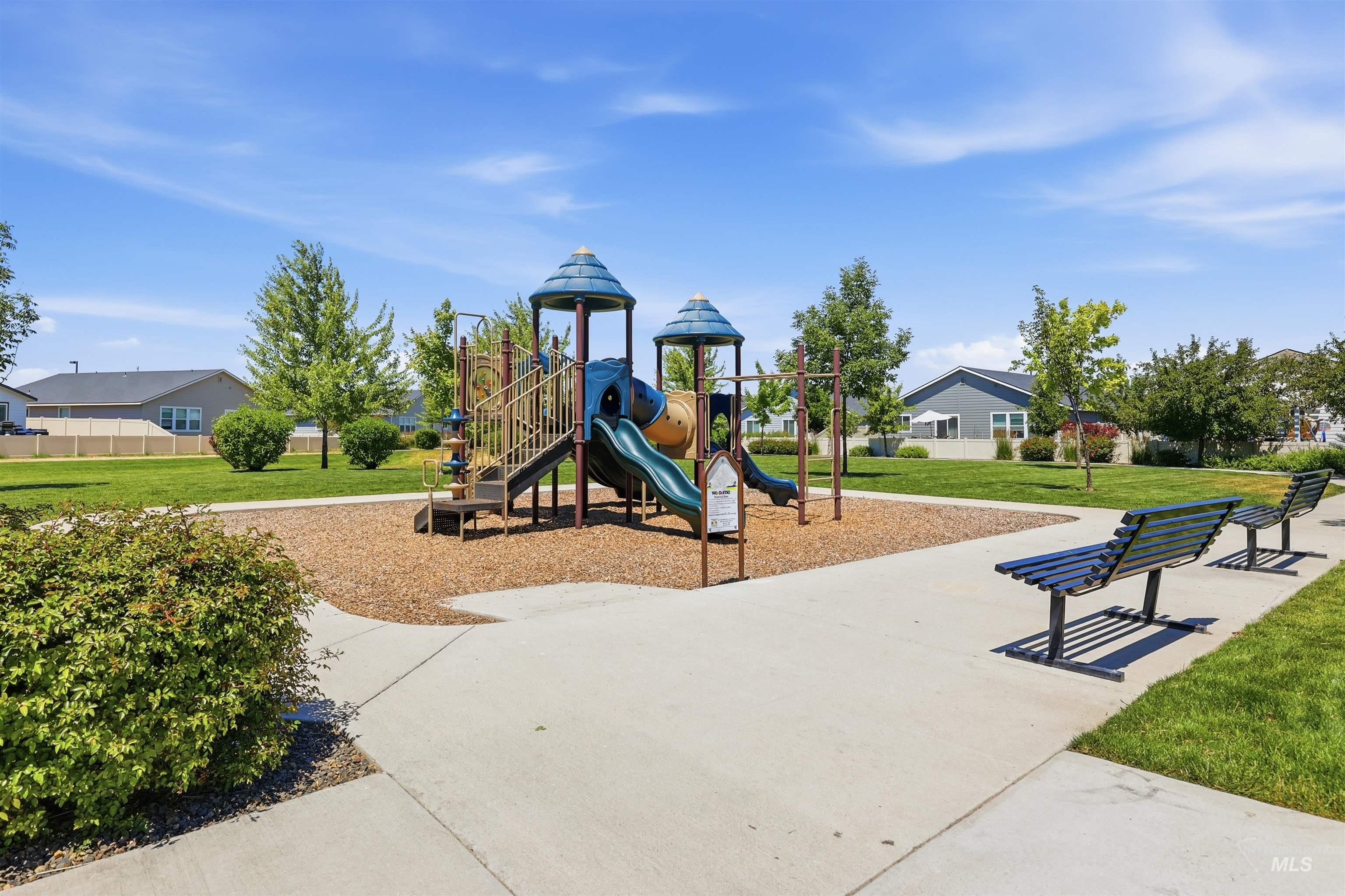 3811 West Maypearl Street Meridian, ID 83642 - Photo 37 of 39 Community playground featuring multi-level play structures, slides, and swings