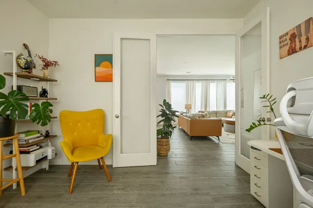 a bedroom with a bed couch and window