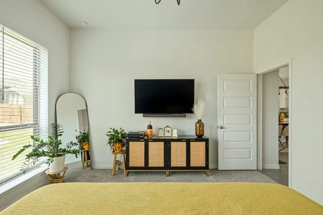 a bathroom with a shower sink and mirror