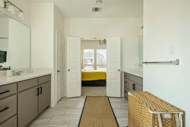 a bathroom with a bathtub and a sink