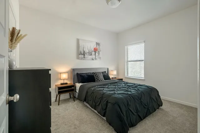a view of a workspace with furniture and a flat screen tv