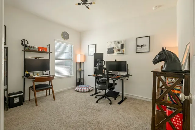 a view of a house with backyard and porch