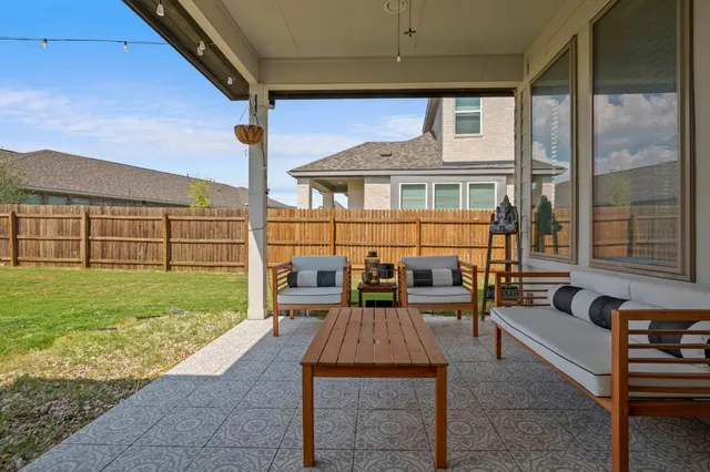 a front view of a house with swimming pool garden view and a lake view