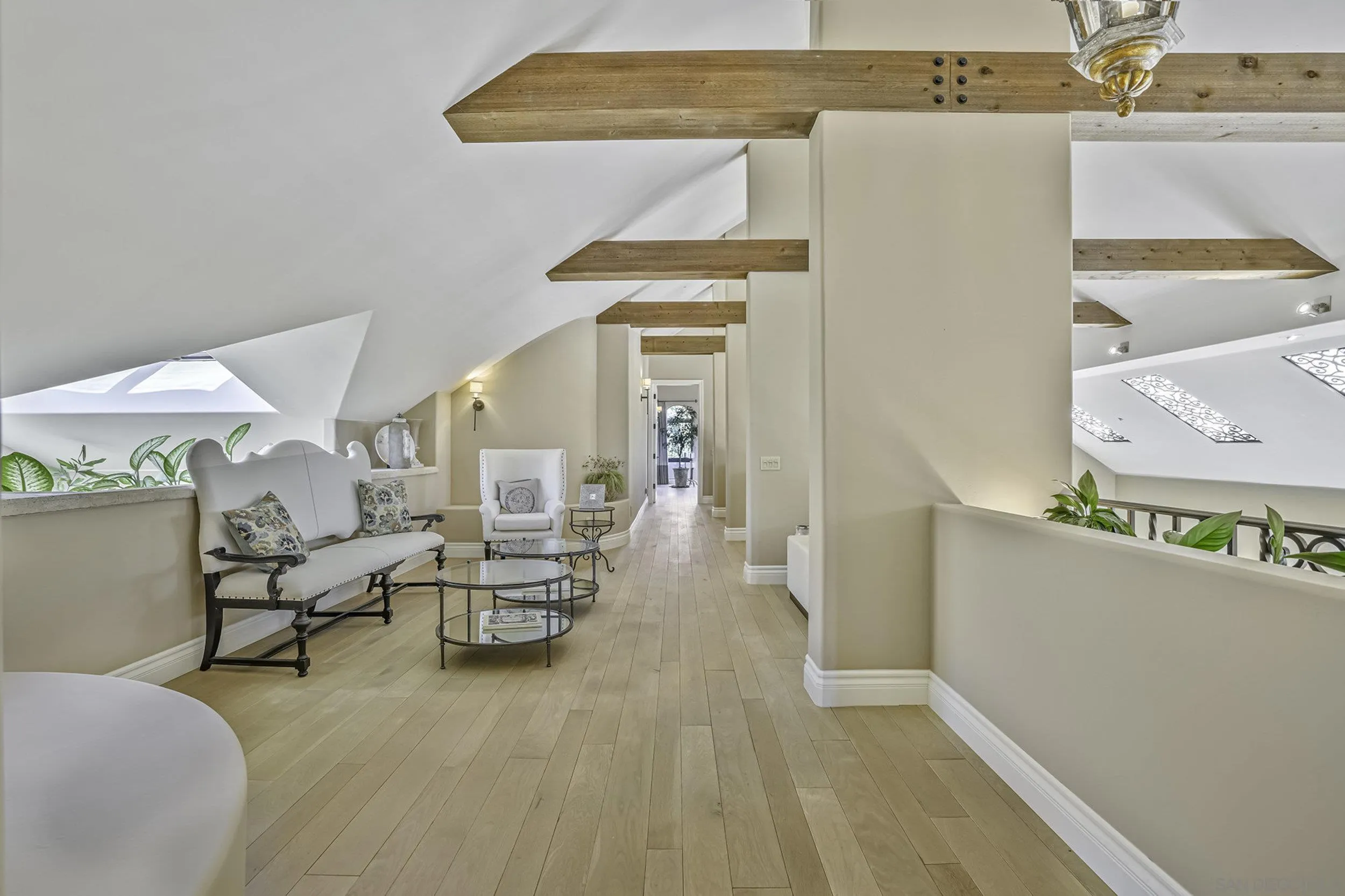 5305 La Crescenta Road Rancho Santa Fe, CA 92067 - Photo 40 of 63 Upstairs hall with sitting areas feature wide plank oak floors and beautiful wood beams