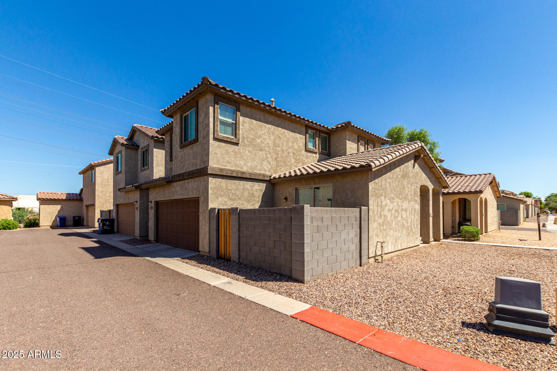 5470 Fulton Street Phoenix, AZ 85043 - Photo 5 of 33 a front view of a house with a wooden fence