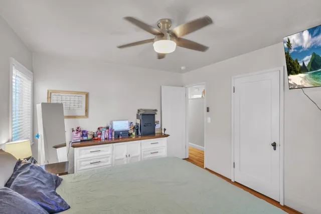 a bathroom with a sink a toilet and a window