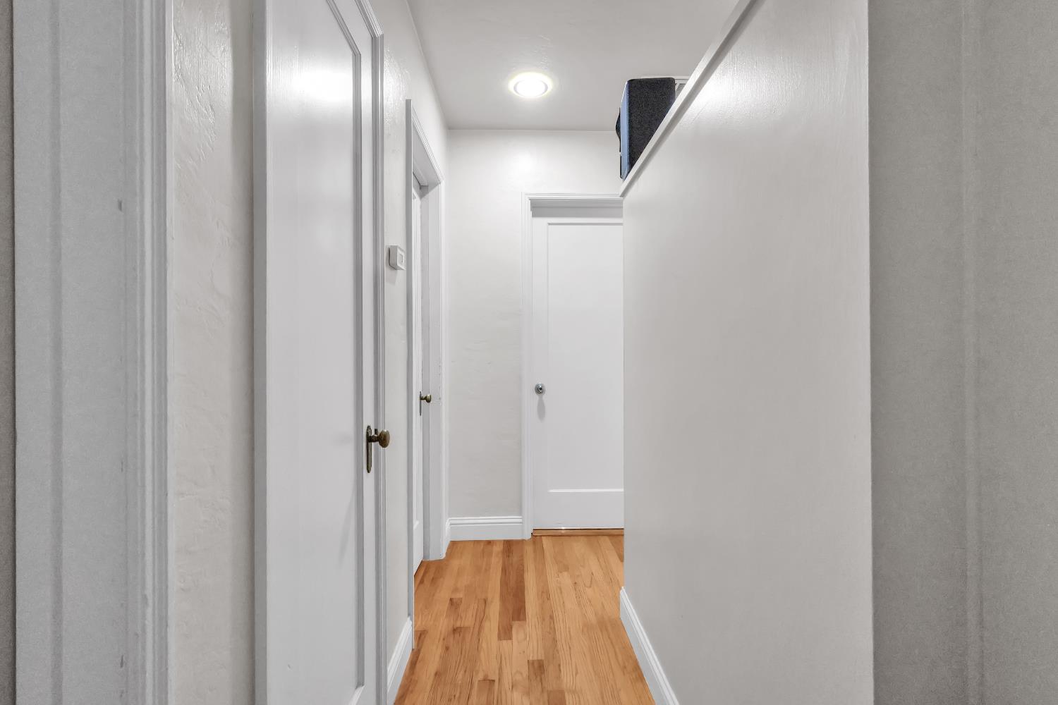 606 West Turner Road Lodi, CA 95240 - Photo 24 of 41 a view of a hallway with wooden floor