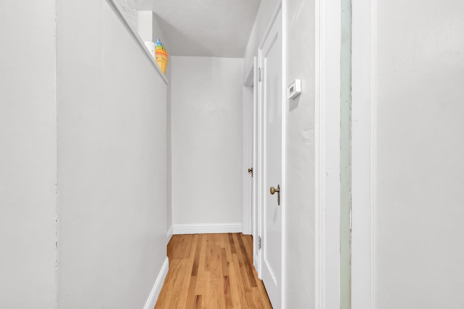 606 West Turner Road Lodi, CA 95240 - Photo 25 of 41 a view of a hallway with wooden floor and entryway