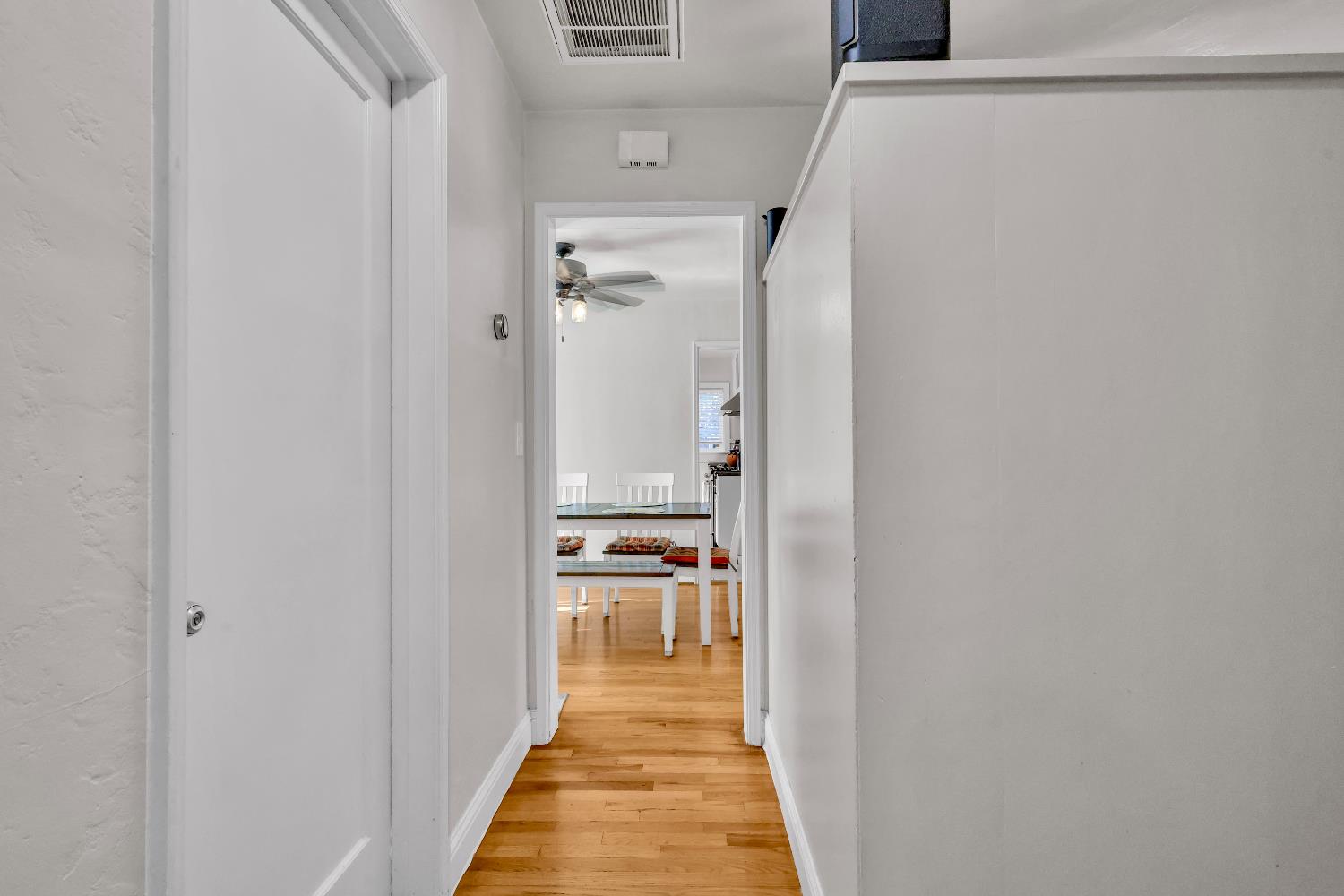 606 West Turner Road Lodi, CA 95240 - Photo 30 of 41 a view of a hallway with wooden floor and a bathroom