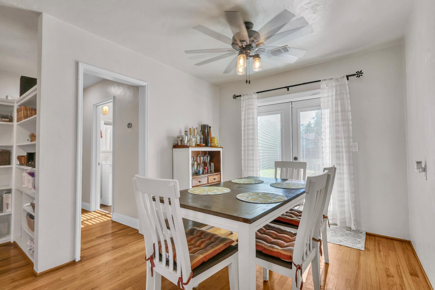 606 West Turner Road Lodi, CA 95240 - Photo 3 of 41 a view of a dining room with furniture window and wooden floor