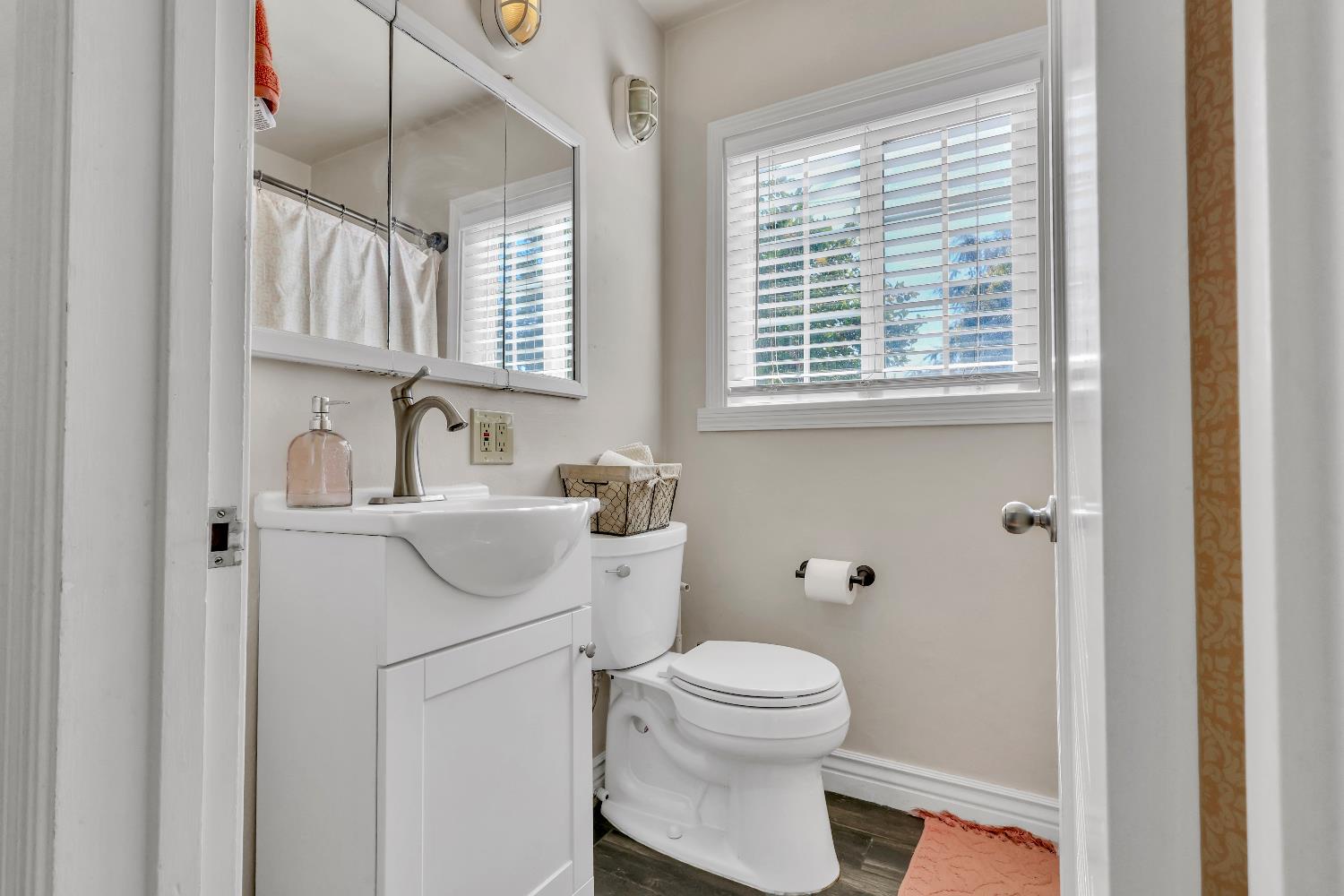 606 West Turner Road Lodi, CA 95240 - Photo 32 of 41 a bathroom with a sink a toilet and a window