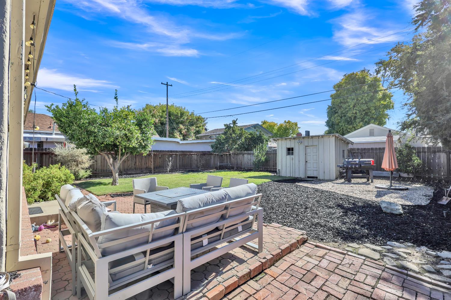 606 West Turner Road Lodi, CA 95240 - Photo 35 of 41 a view of a backyard with sitting area