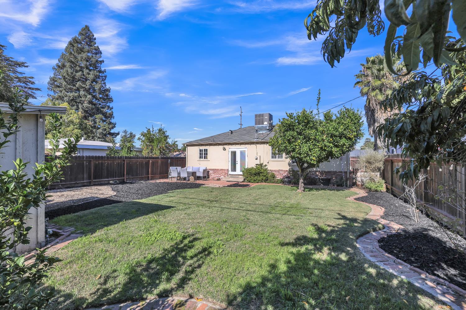 606 West Turner Road Lodi, CA 95240 - Photo 38 of 41 a view of a house with backyard and sitting area