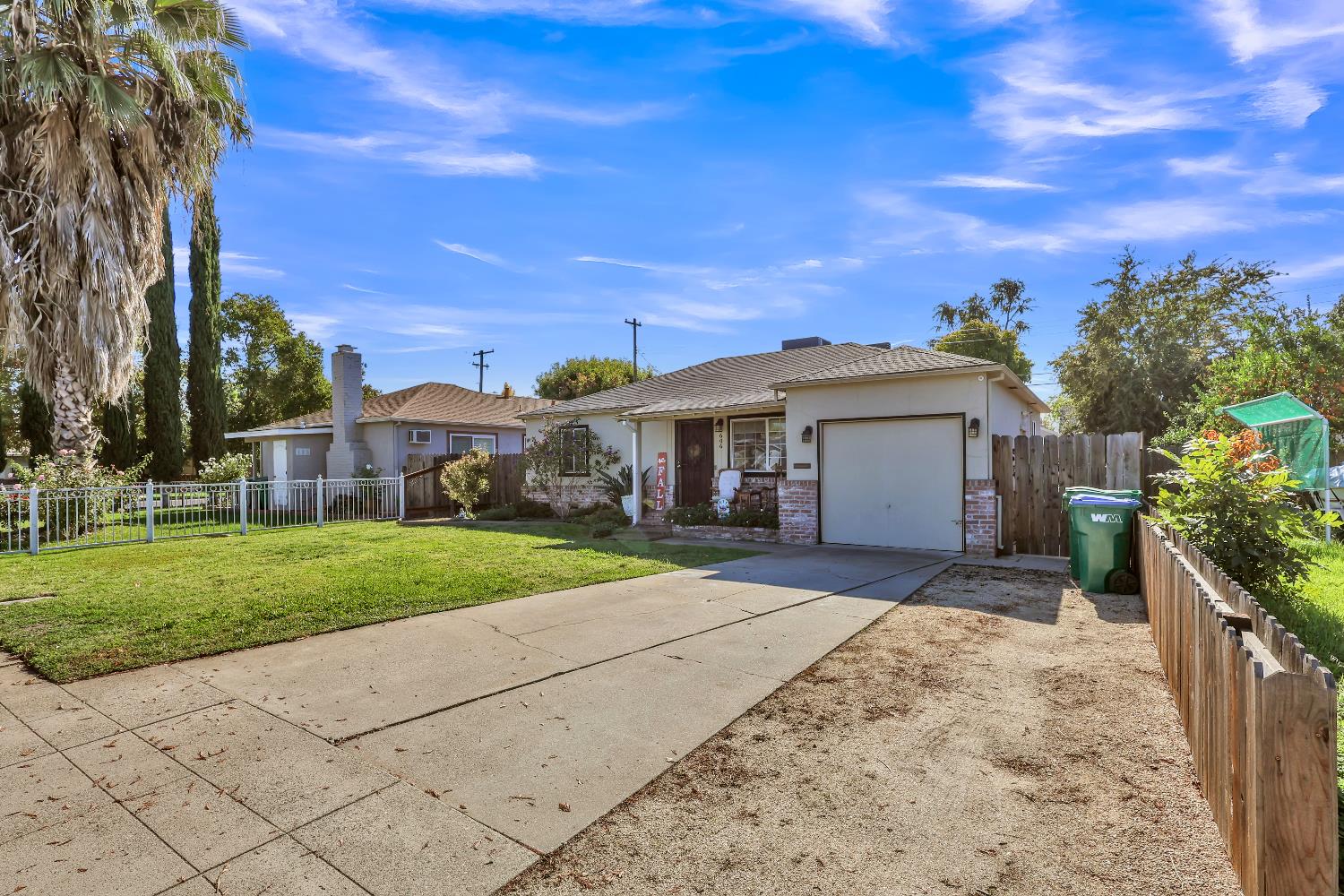 606 West Turner Road Lodi, CA 95240 - Photo 5 of 41 a front view of a house with a yard and pathway