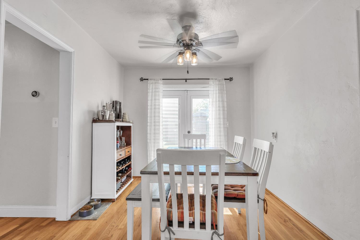 606 West Turner Road Lodi, CA 95240 - Photo 7 of 41 a view of a dining room with furniture and wooden floor