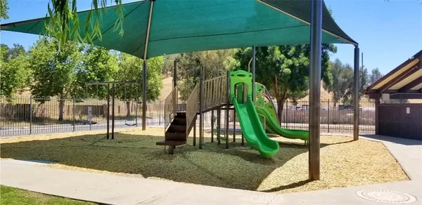a view of a park with potted plants