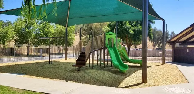 a view of a park with potted plants