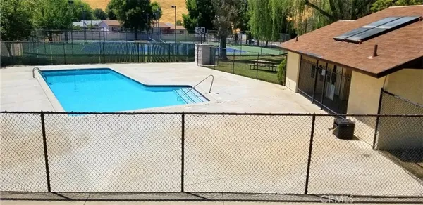 a view of a swimming pool with a backyard