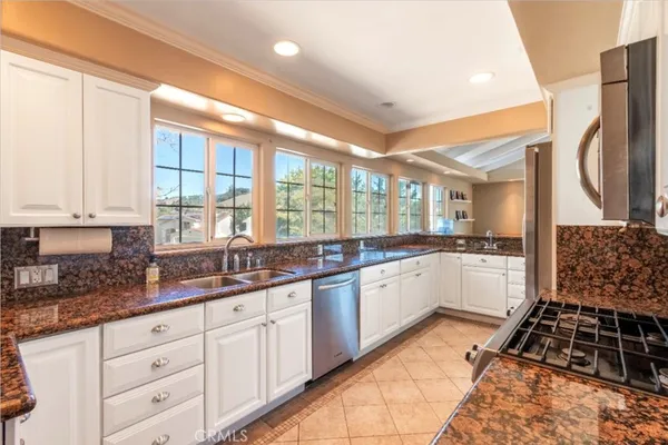 a large kitchen with a large window