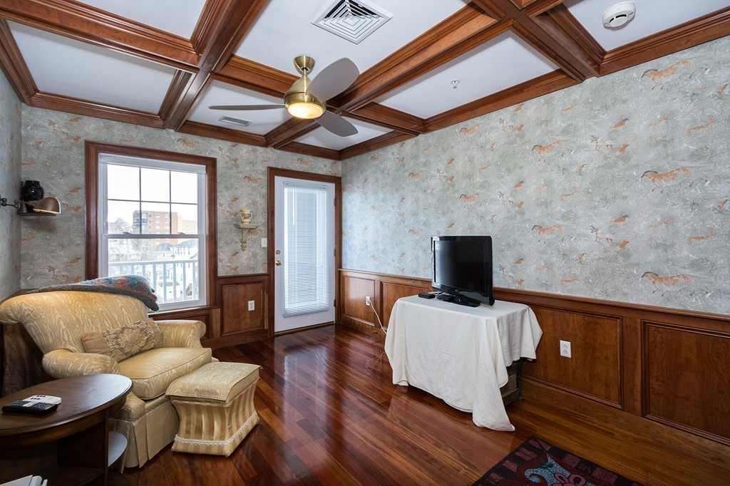 15 Park Avenue, Unit 401 Hull, MA 02045 - Photo 11 of 24 a living room with furniture and a flat screen tv