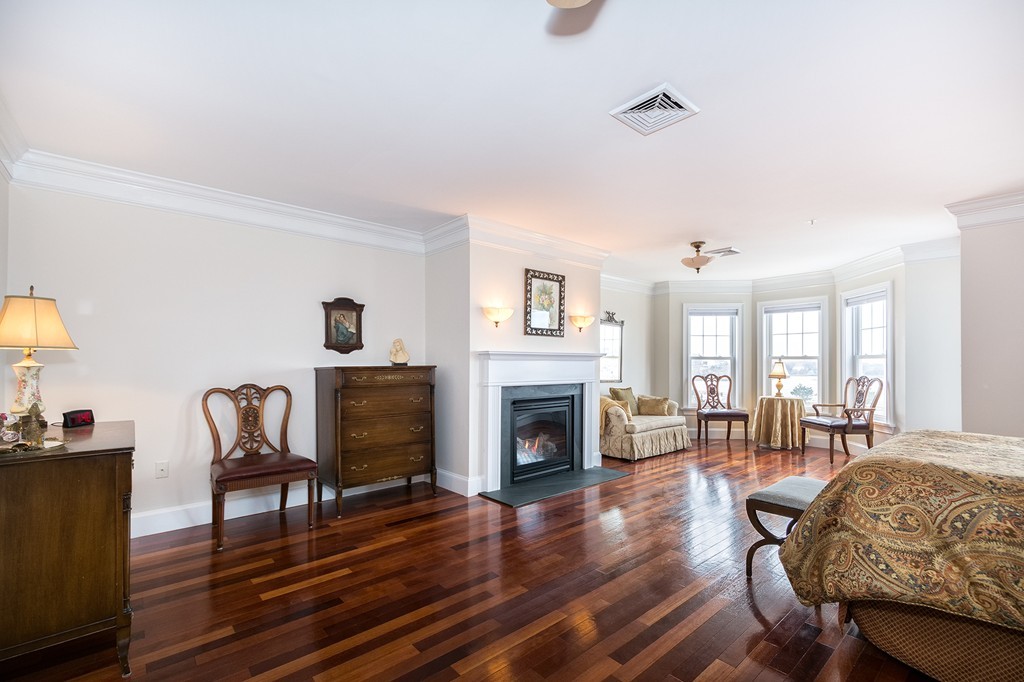 15 Park Avenue, Unit 401 Hull, MA 02045 - Photo 13 of 24 a living room with furniture and a fireplace