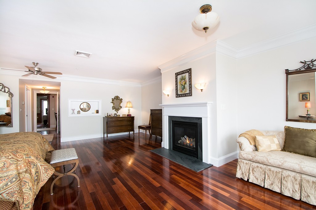 15 Park Avenue, Unit 401 Hull, MA 02045 - Photo 14 of 24 a living room with furniture and a fireplace