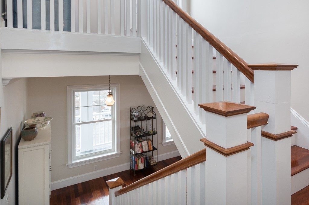 15 Park Avenue, Unit 401 Hull, MA 02045 - Photo 16 of 24 a view of stairs and an entryway with wooden floor