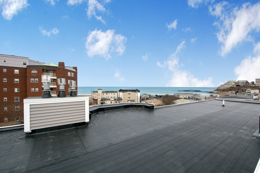 15 Park Avenue, Unit 401 Hull, MA 02045 - Photo 20 of 24 a view of an ocean and beach